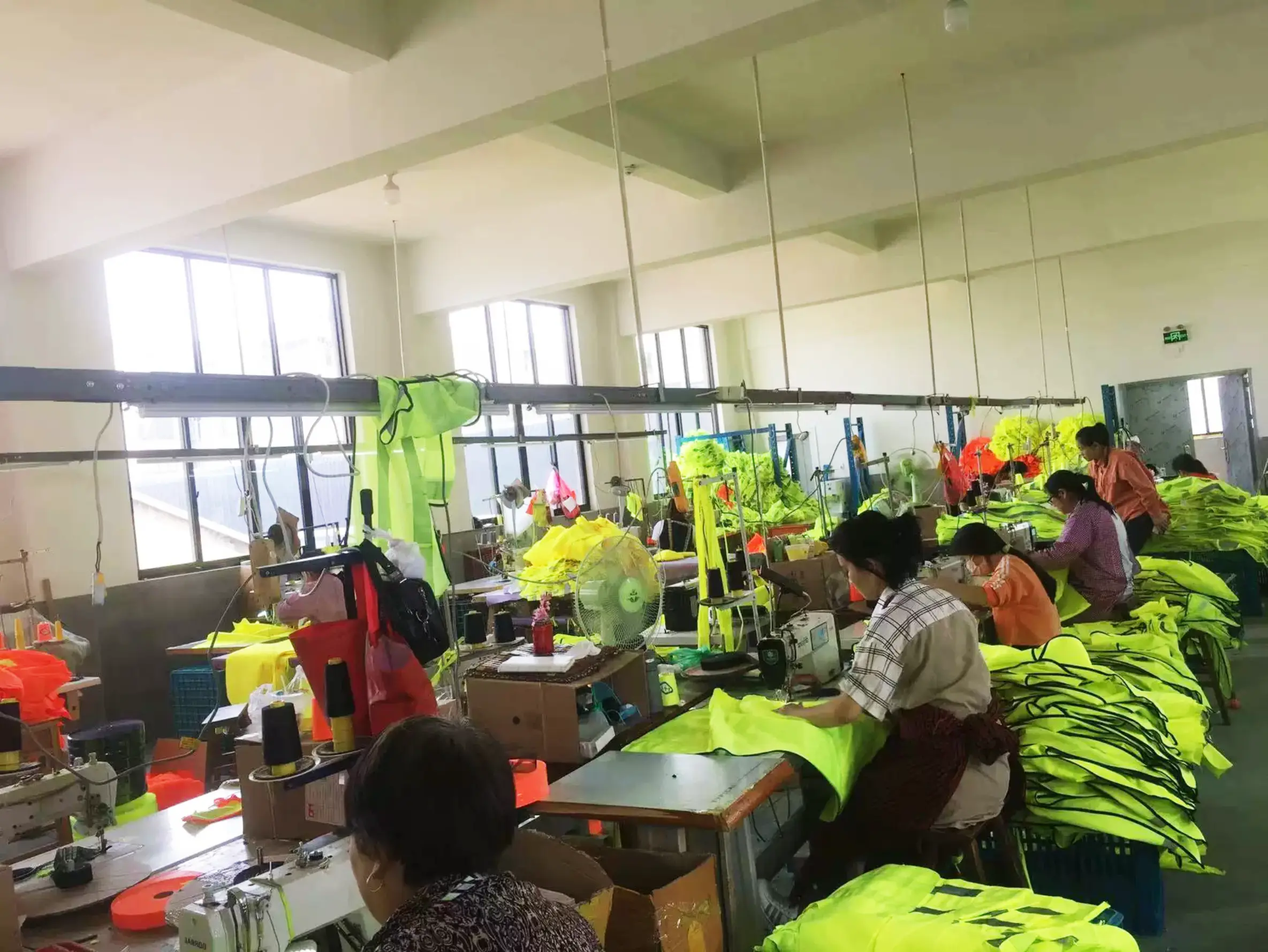Sewing workstations producing high-visibility garments for bulk workwear orders
